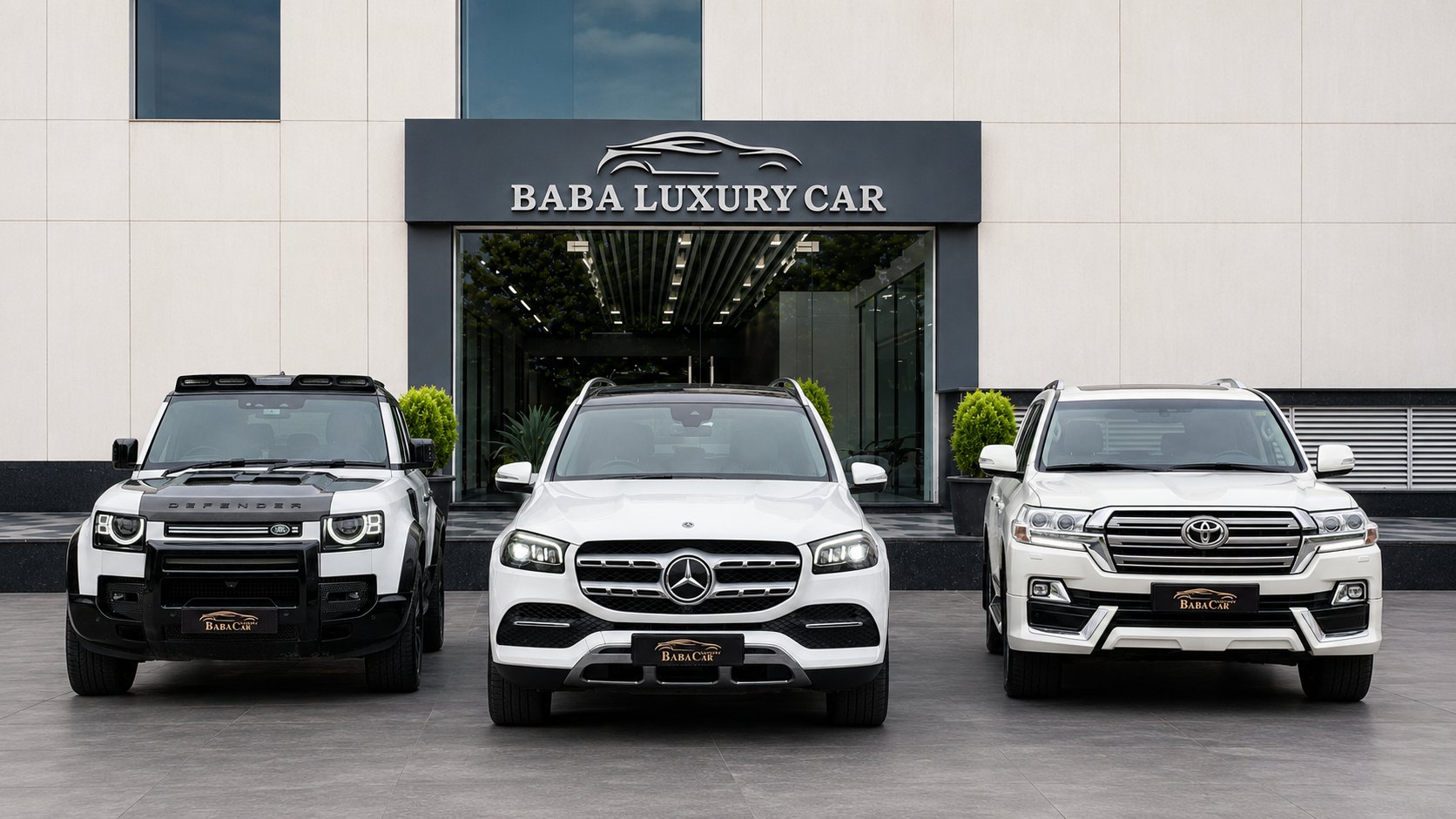 Baba Luxury Car showroom with featured vehicles parked outside at Emaya Mall, Paschim Vihar, New Delhi.